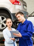 Car mechanic and customer talking